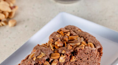 Slice of Zero Waste chocolate and peanut cake with aquafaba